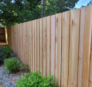 Cedar fence posts and planks make a durable choice
