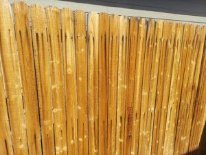 Rust streaked wooden fence