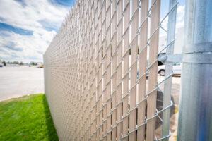 Commercial chain link fence with privacy slates