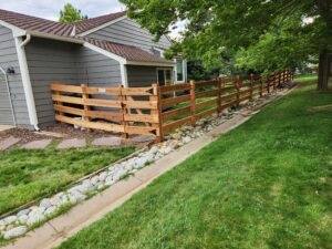 Cedar open rail fence and gate Ken Caryl Master Association
