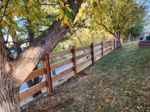 Cedar open rail fence with welded wire Ken Caryl Master Association