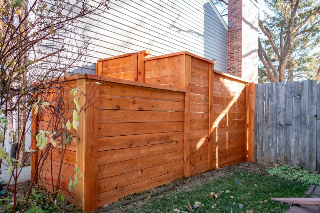 Horizontal Cedar fence with Top Cap and Cedar Stain Longmont