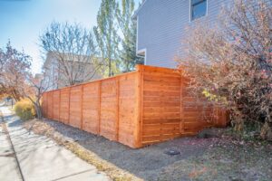 Horizontal Cedar fence with Top Cap and Cedar Stain Longmont