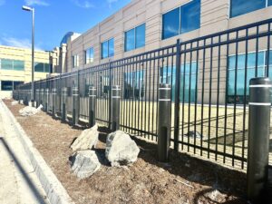 Ornamental iron fence and parking bollards