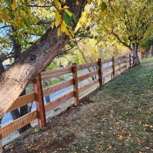 Cedar open rail fence with welded wire Ken Caryl Master Association