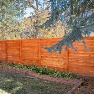 Horizontal Cedar fence with Top Cap and Cedar Stain