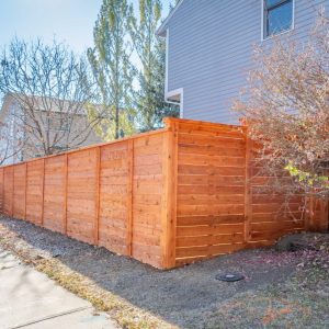 Horizontal Cedar fence with Top Cap and Cedar Stain Longmont