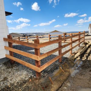 Cedar open rail fence with wire