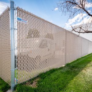 Commercial chain link fence with privacy slates
