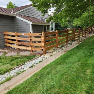 Cedar open rail fence and gate Ken Caryl Master Association