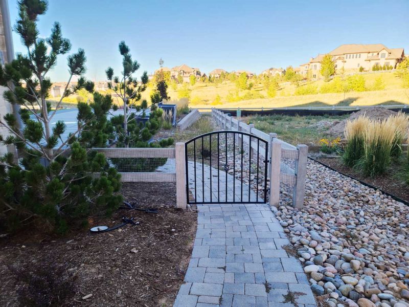 Iron Gate with Concrete Split Rail Fence